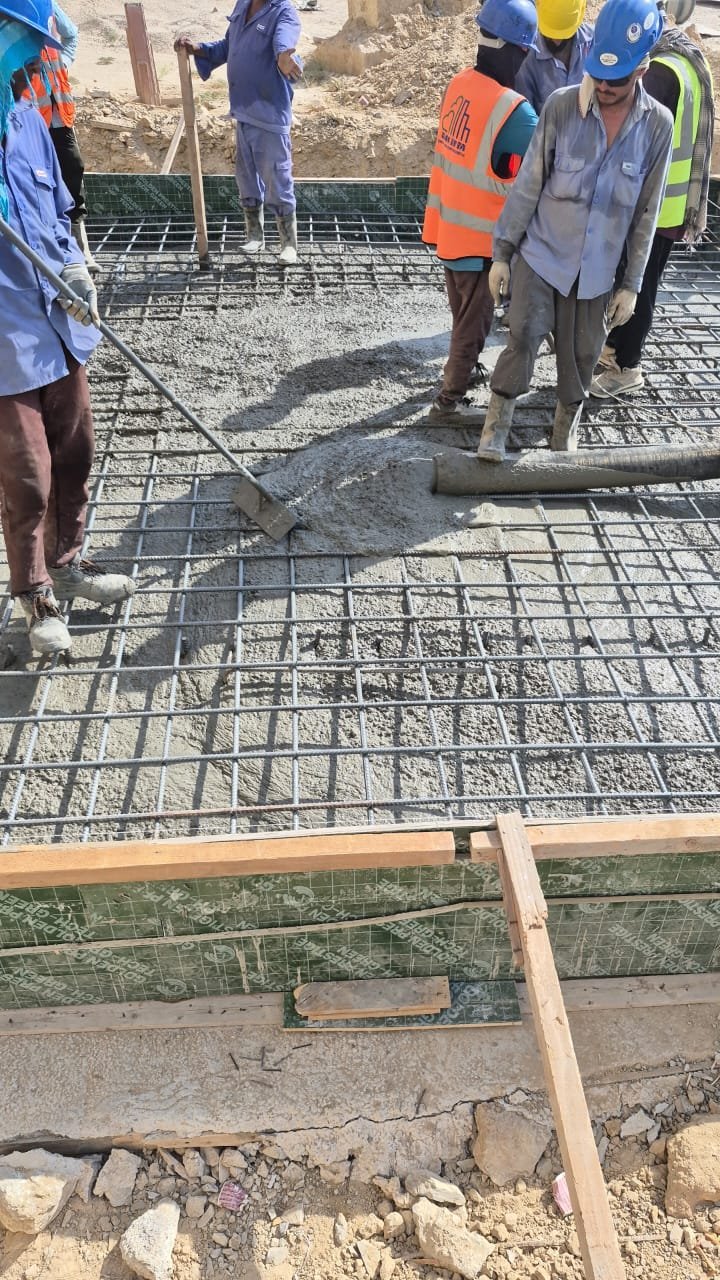 Crew working a reinforcement mat